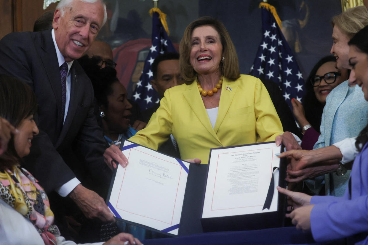 House Majority Leader Steny Hoyer (D-MD), Speaker of the House Nancy Pelosi and Rep. Carolyn Maloney (D-NY) hold a signed copy of H.R. 6376, the 