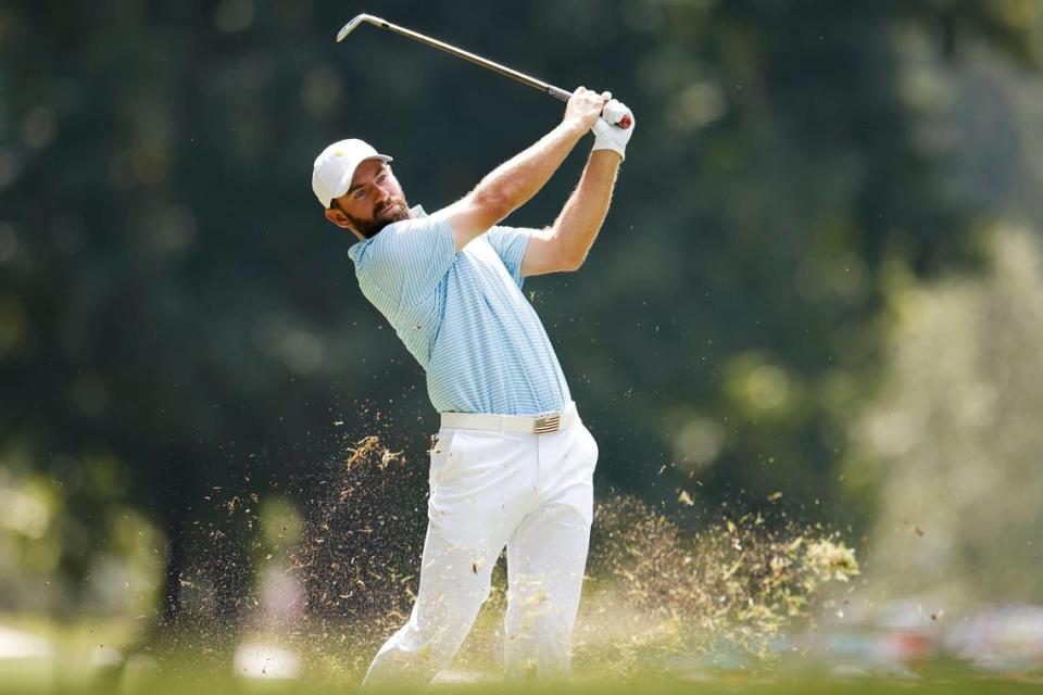 Cameron Young takes his second shot on the second fairway during the Presidents Cup golf tournament at the Quail Hollow Club in Charlotte, N.C., Thursday, Sept. 22, 2022.