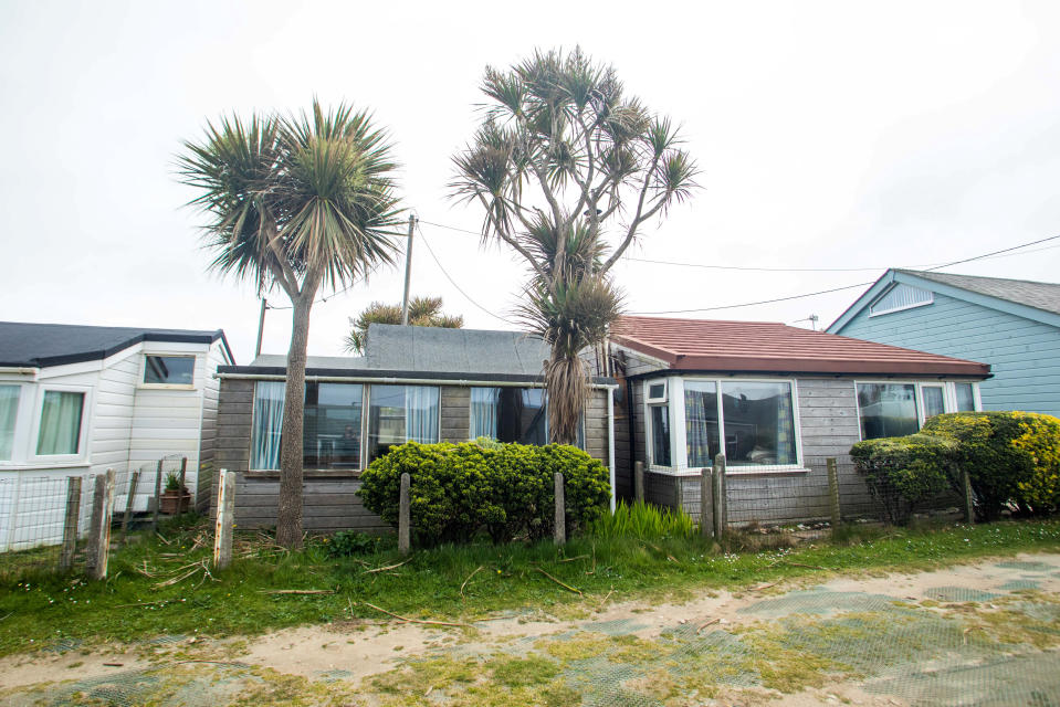 A beach chalet in Gwithian Towans, Cornwall, has hit the market with a Â£350,000 guide price. 4th May 2022 See SWNS story SWPLchalet. This tiny beachside chalet in Cornwall is being sold for a guide price of Â£350k. The two-bedroom detached coastal property - which doesn't include a working toilet - is  situated just a short stroll from Gwithian Sands beach, in Hayle. It has now come on the market with a guide price of Â£325,000 to Â£350,000. With just 204 square feet of floor space, the compact home has separate kitchen and lounge areas, and two bedrooms in the main building.  

 