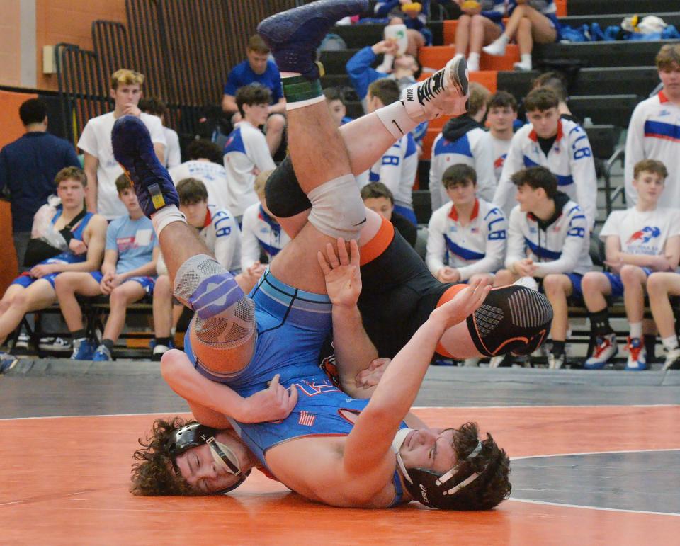 At 172 pounds, Fort LeBouef High School's Ryan Welka, front, wrestles Corry's Mason Savitz during the District 10 Class 2A team wrestling championships at Sharon High School in Sharon on Feb. 3, 2024.