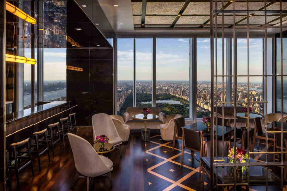 a room with floor-to-ceiling windows overlooking Central Park on the 100th floor of luxury skyscraper Central Park Tower