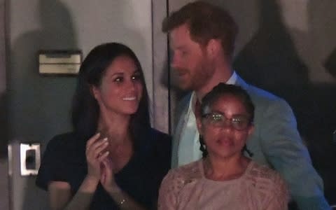 Prince Harry, with Meghan Markle and her mother at the Invictus Games - Credit: Wireimage