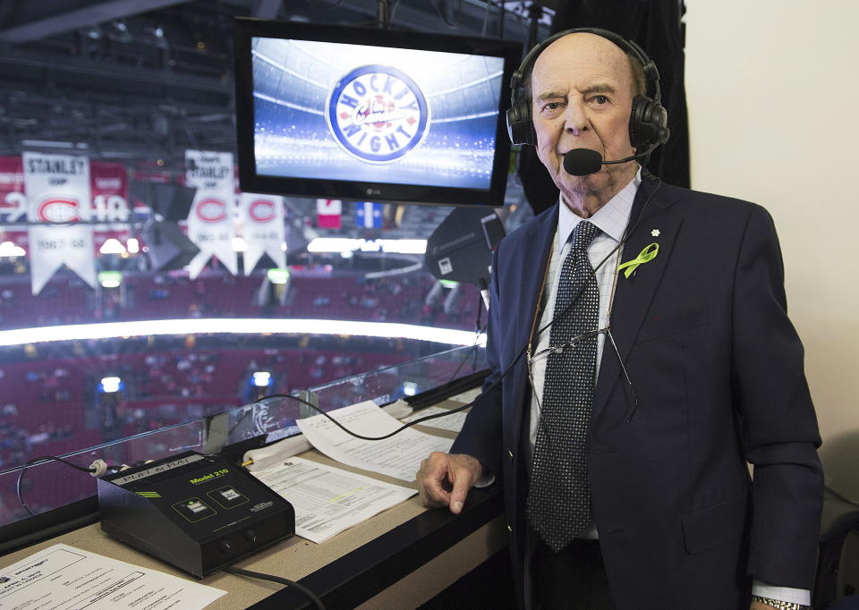 FILE - Broadcaster Bob Cole poses prior to calling his last NHL hockey game between the Montreal Canadiens and the Toronto Maple Leafs in Montreal, Saturday, April 6, 2019. Cole, the voice of hockey in Canada for a half-century, has died. He was 90. (Graham Hughes/The Canadian Press via AP, FIle)