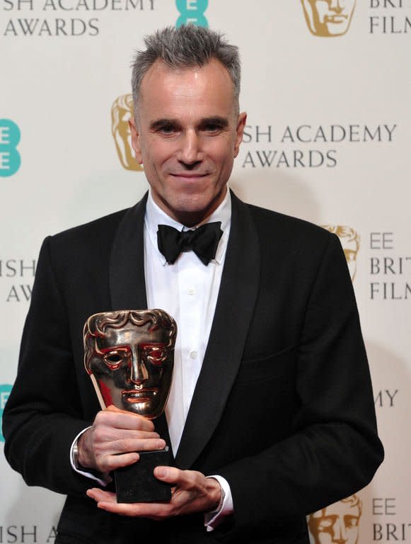 British actor Daniel Day-Lewis poses with the award for best leading actor for his performance in the film Lincoln during the annual BAFTA British Academy Film Awards at the Royal Opera House in London on February 10, 2013