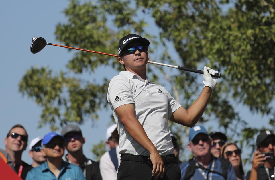 Kurt Kitamaya from the U.S. follows his ball on the 2nd hole during the final round of the Abu Dhabi Championship golf tournament in Abu Dhabi, United Arab Emirates, Sunday, Jan. 19, 2020. (AP Photo/Kamran Jebreili)