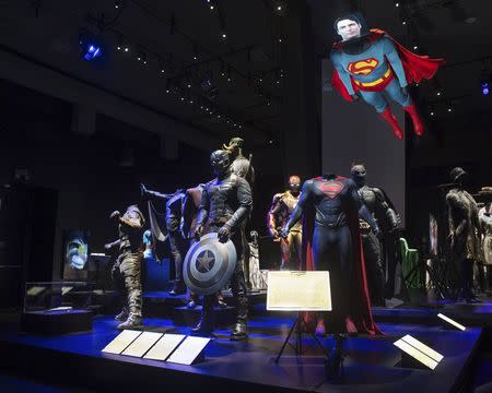 Superhero costumes are shown on display at the Hollywood Costume exhibit, curated by the Academy of Motion Pictures Arts and Sciences and London's Victoria & Albert museum, at the future home of the Academy Museum of Motion Pictures in Los Angeles, in this publicity photo released to Reuters on September 30, 2014. REUTERS/Greg Harbaugh/Copyright 2014 AMPAS/Handout via Reuters