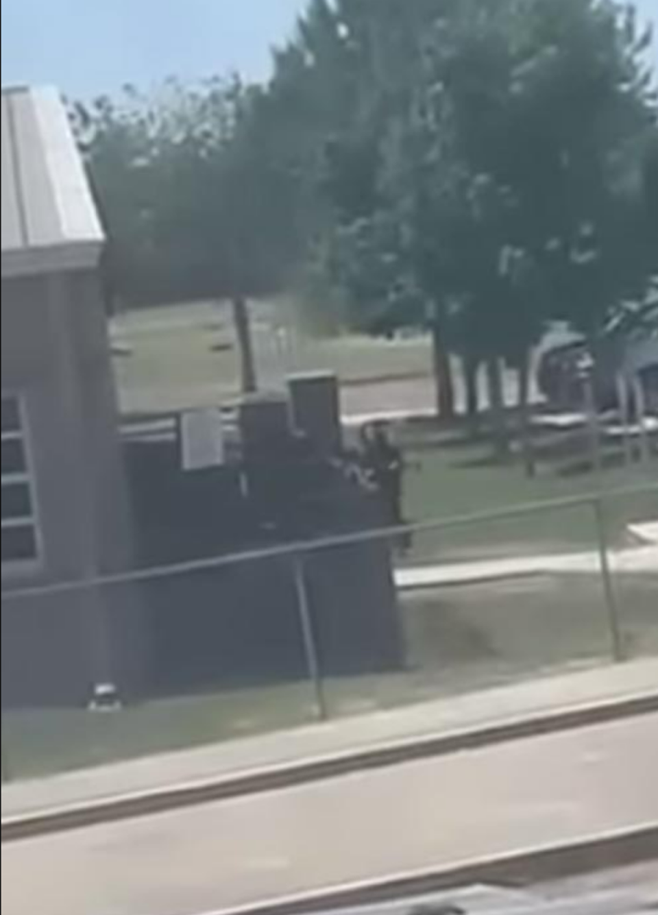 A video from the scene of the shooting showed the gun man walking into the school (Facebook/screengrab)