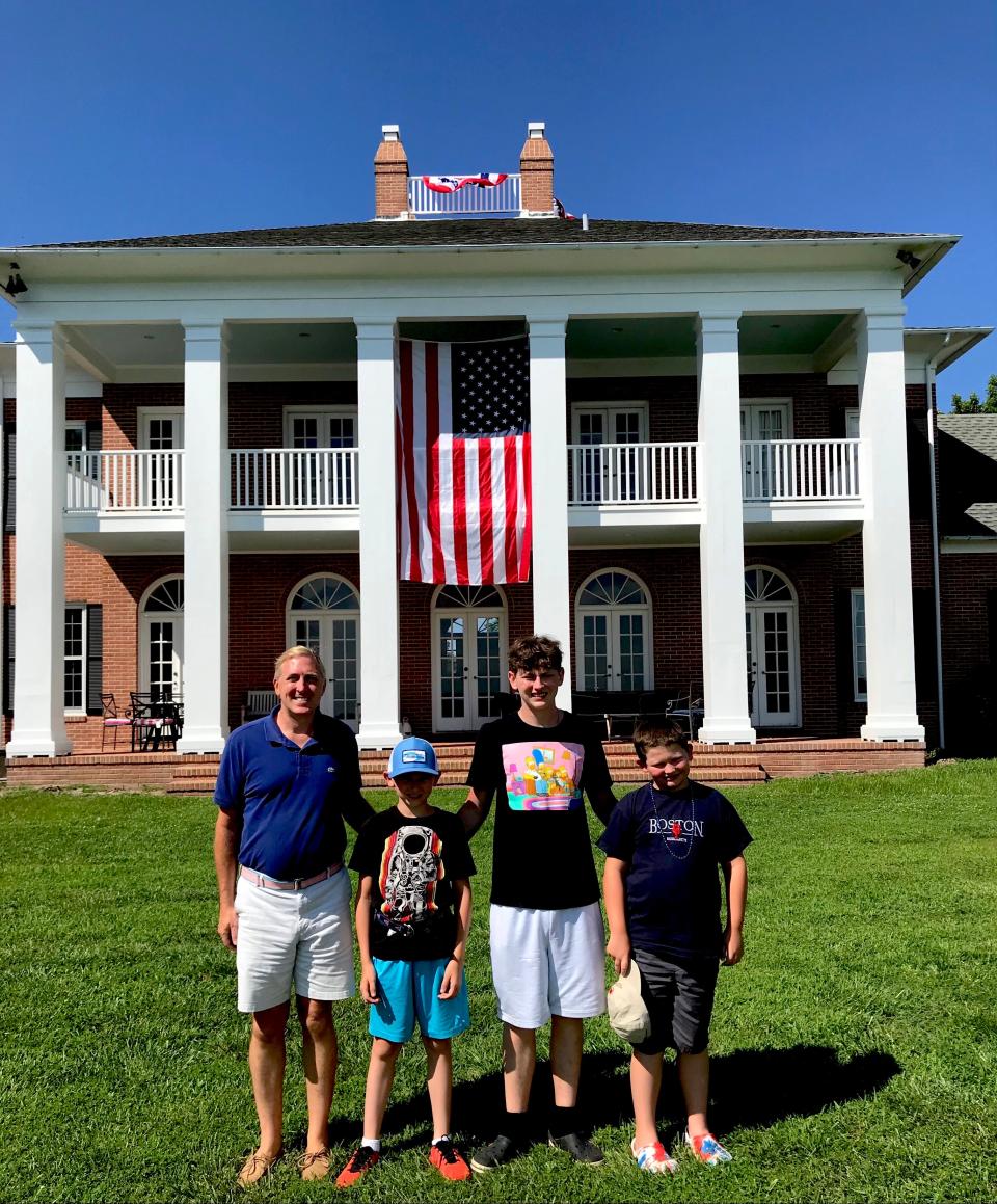 Chuck Poole and his nephews celebrate the Fourth at his Federal-era home on the Maryland shore