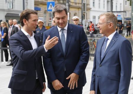 Austria's Chancellor Sebastian Kurz talks with Bavaria's Prime Minister Markus Soeder and Upper Austria governor Thomas Stelzer before a joint cabinet meeting in Linz, Austria, June 20, 2018. REUTERS/Leonhard Foeger