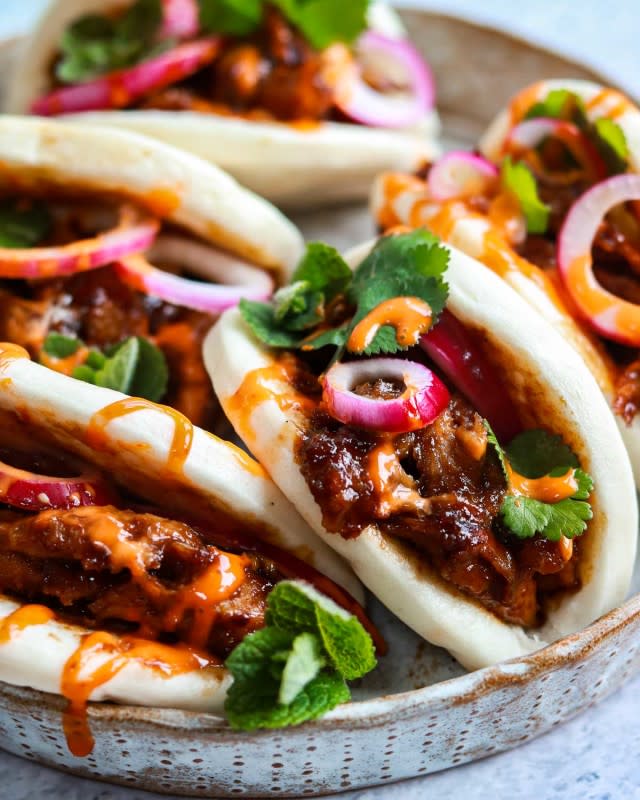 <p>Easy-to-make bao bun sandwiches are stuffed with Hoisin seitan "chicken" along with lots of herbs and pickles!</p><p><strong>Get the recipe: <a href="https://theveganlarder.com/easy-vegan-hoisin-seitan-chkn-bao/" rel="nofollow noopener" target="_blank" data-ylk="slk:Easy Vegan Hoisin Seitan Chicken Bao;elm:context_link;itc:0;sec:content-canvas" class="link rapid-noclick-resp">Easy Vegan Hoisin Seitan Chicken Bao</a></strong></p><p><strong>Related: <a href="https://parade.com/1164416/kavitharamaswamy/viral-plant-based-recipes/" rel="nofollow noopener" target="_blank" data-ylk="slk:14 Viral Plant-Based Recipes;elm:context_link;itc:0;sec:content-canvas" class="link rapid-noclick-resp">14 Viral Plant-Based Recipes</a></strong></p>