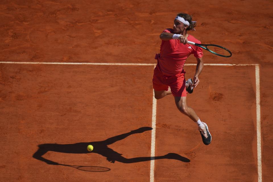 Stefanos Tsitsipas of Greece returns the ball to Casper Ruud of Norway during their Monte Carlo Tennis Masters final match in Monaco, Sunday, April 14, 2024. (AP Photo/Daniel Cole)