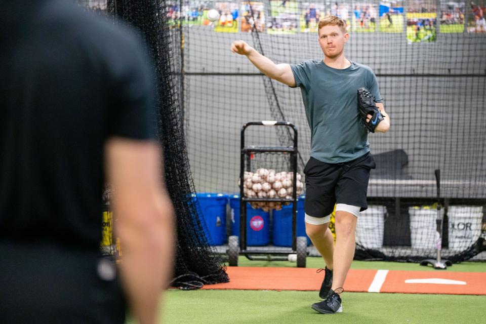 Iowa native Mitch Keller, a right-handed pitcher for the Pittsburgh Pirates, plays catch at Dugout Sports in Fairfax on Jan. 24.