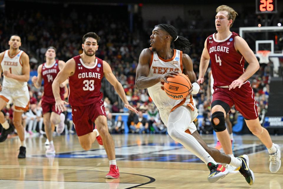 Texas guard Marcus Carr dribbles against the Colgate defense during the second half. Carr finished the game with 17 points, including four 3-point shots.