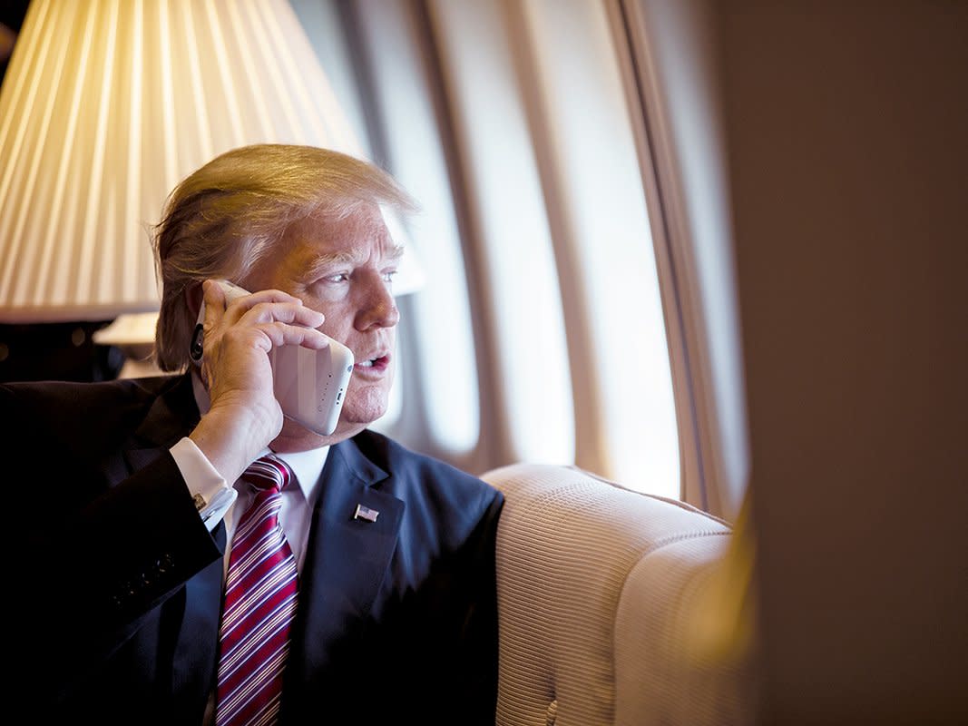 Donald Trump speaks on the phone aboard Air Force One during a flight to Philadelphia in 2017: The White House