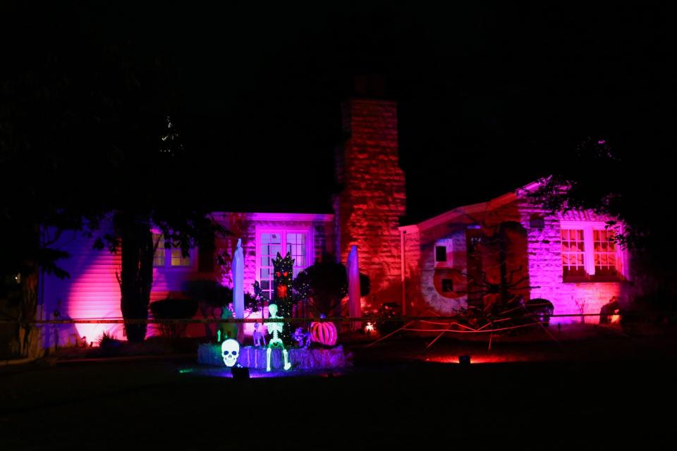 Pink lights illuminate the house at 1961 S. Holland Ave. on Monday, Oct. 9, 2023.