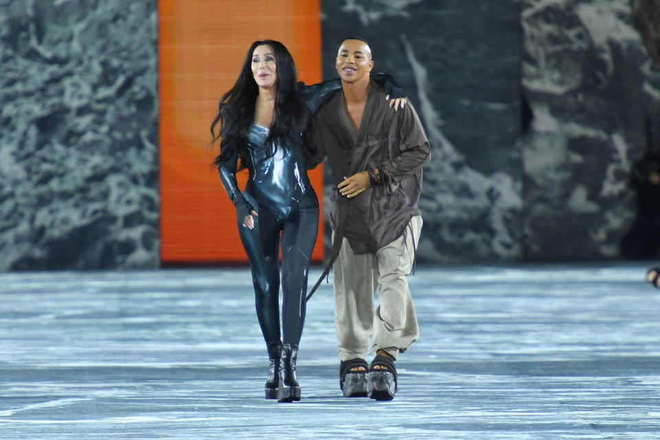 PARIS, FRANCE - SEPTEMBER 28: (EDITORIAL USE ONLY - For Non-Editorial use please seek approval from Fashion House) Singer Cher and Olivier Rousteing walk the runway during the Balmain Womenswear Spring/Summer 2023 show as part of Paris Fashion Week on September 28, 2022 in Paris, France. (Photo by Dominique Charriau/Getty Images)