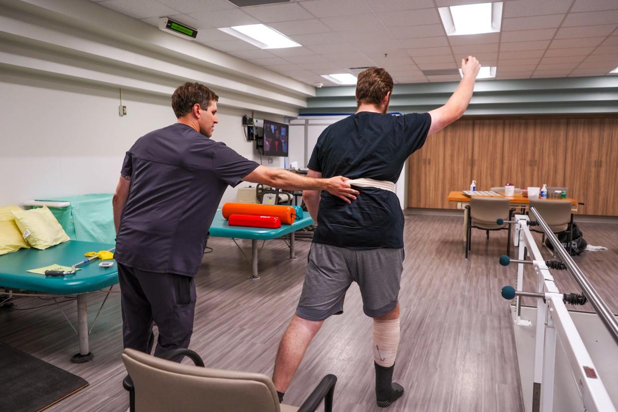 A Tallahassee Police officer performs therapy exercises as part of his recovery after being shot while on duty in September 2023.