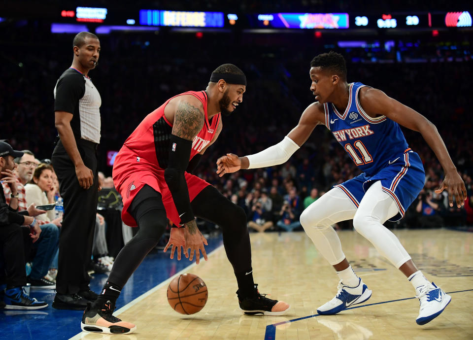 NEW YORK, NEW YORK - JANUARY 01: Carmelo Anthony #00 of the Portland Trail Blazers is guarded by Frank Ntilikina #11 of the New York Knicks during the first half of their game at Madison Square Garden on January 01, 2020 in New York City. NOTE TO USER: User expressly acknowledges and agrees that, by downloading and or using this photograph, User is consenting to the terms and conditions of the Getty Images License Agreement. (Photo by Emilee Chinn/Getty Images)