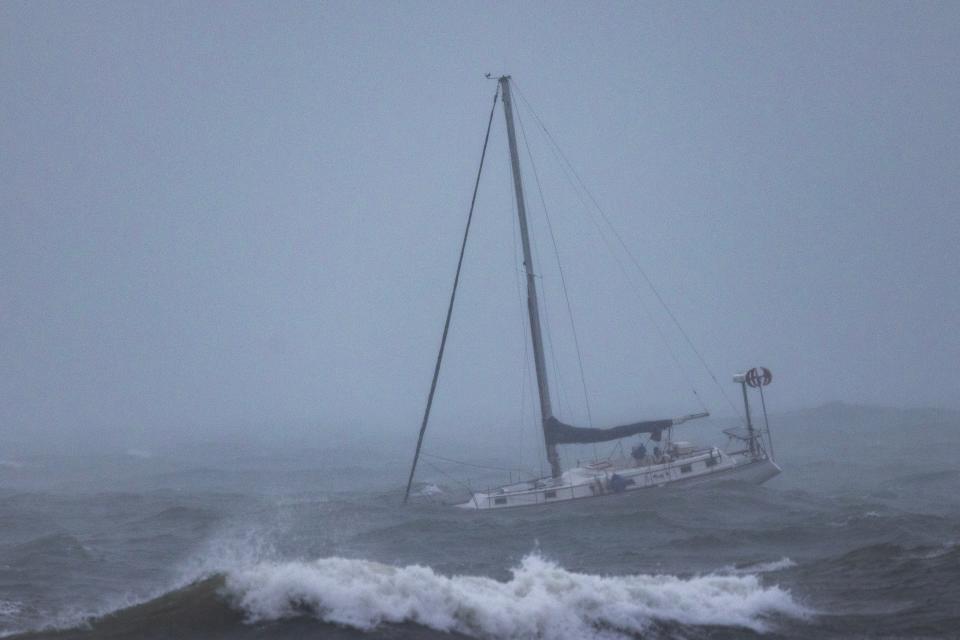 A boat moored offshore is tossed by rough waters as the second and more powerful of two atmospheric river storms arrives to Santa Barbara, California, on February 4, 2024. The US West Coast was getting drenched on February 1 as the first of two powerful storms moved in, part of a u0022Pineapple Expressu0022 weather pattern that was washing out roads and sparking flood warnings. The National Weather Service said u0022the largest storm of the seasonu0022 would likely begin on February 4.