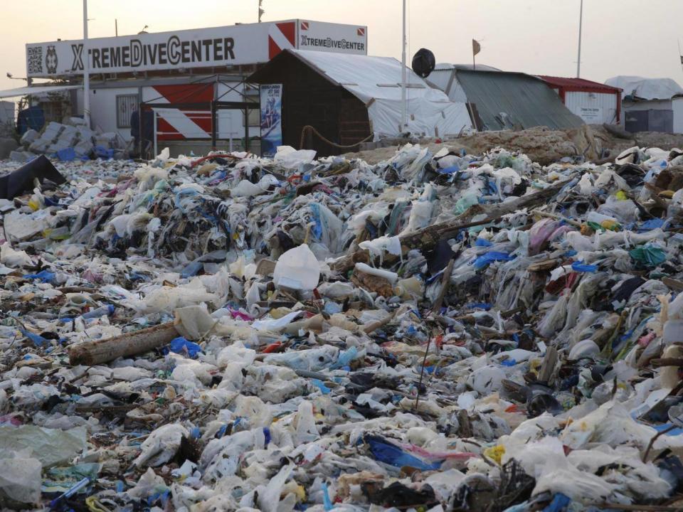 The shore at Zouq Mosbeh was covered in piles of rubbish this week (Hussein Malla/AP)