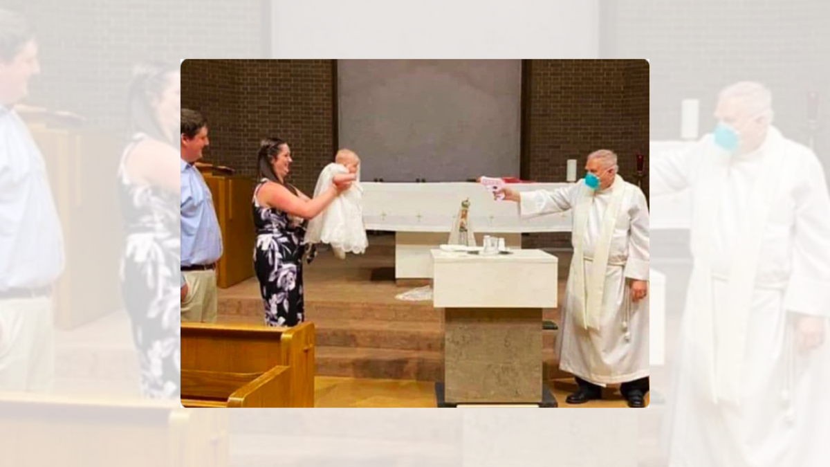 A priest wearing a mask points a water gun at a baby and their family. @goddeketal/Twitter