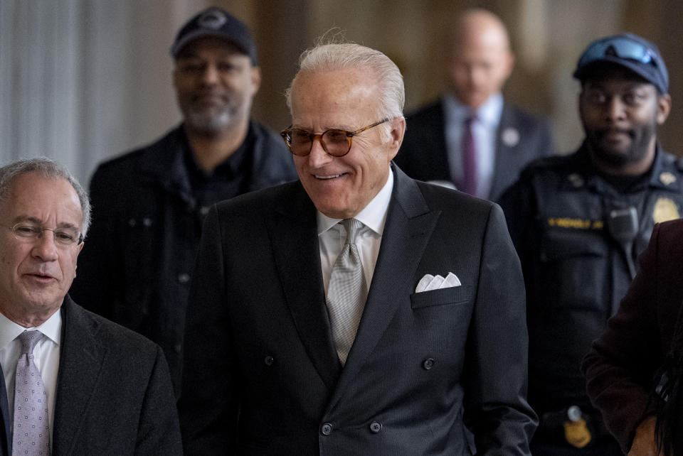 James Biden, brother of President Joe Biden, accompanied by Attorney Paul Fishman, left, arrives for a private interview with House Republicans at Thomas P. O'Neill House Office Building on Capitol Hill in Washington, Wednesday, Feb. 21, 2024. (AP Photo/Andrew Harnik)