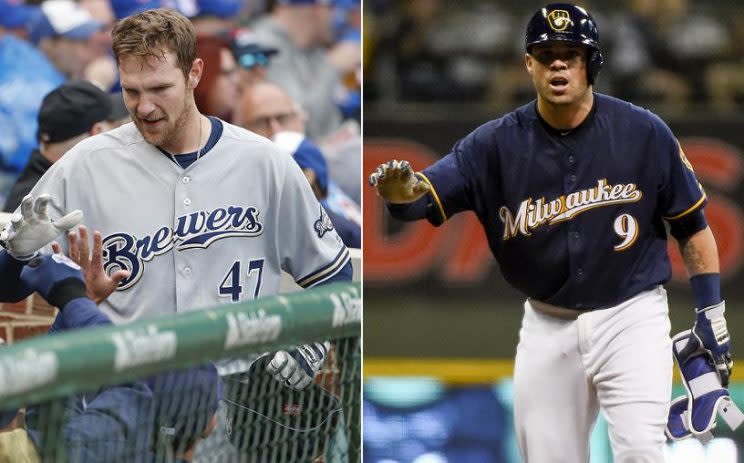 Catchers Jett Bandy (left) and Manny Pina (right) have played key roles in the Brewers respectable start. (AP photos) 