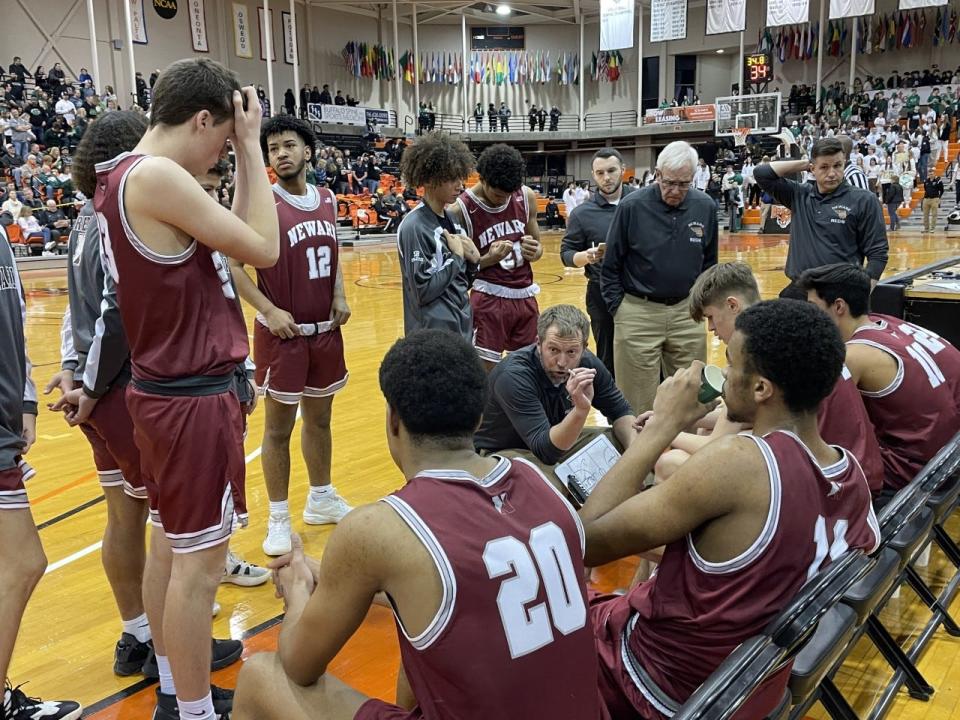 Newark coach Henry Kuperus talks to his Reds during a timeout of the NYSPHSAA Class B Far West Regionals at Buffalo State College. Newark lost to Allegany-Limestone 45-30.