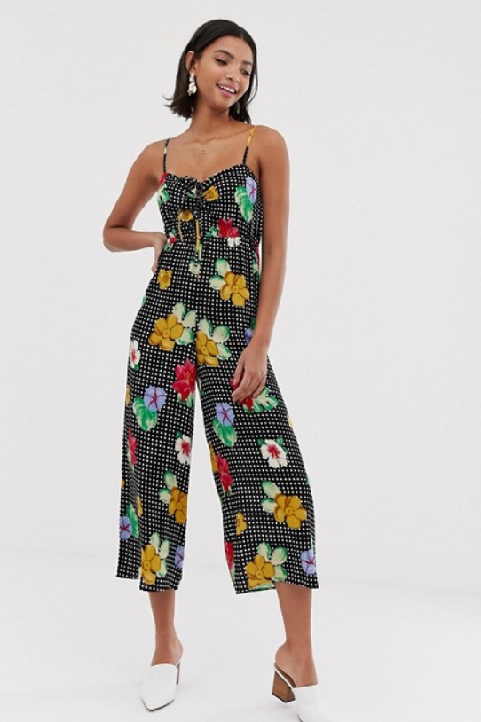 A photo of a model wearing the ASOS DESIGN cami jumpsuit with gathered bodice in floral print.