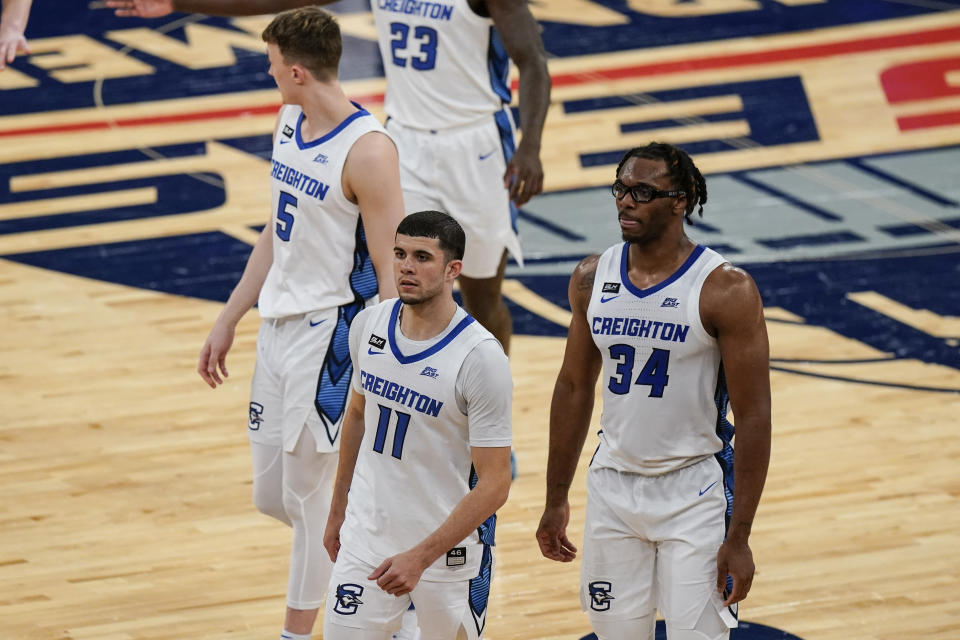 Creighton's Marcus Zegarowski (11), Denzel Mahoney (34) and Alex O'Connell (5) head to the bench during the second half of the team's NCAA college basketball game against Butler in the Big East men's tournament Thursday, March 11, 2021, in New York. (AP Photo/Frank Franklin II)