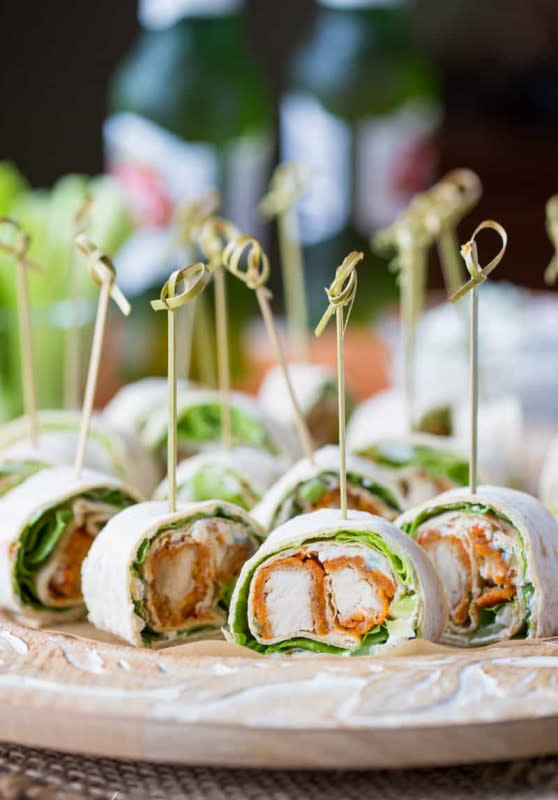 <p>Saving Room For Dessert</p><p>These spicy roll-ups are sure to please!</p><p><strong>Get the recipe</strong>: <a href="https://www.savingdessert.com/buffalo-chicken-roll-appetizers/" rel="nofollow noopener" target="_blank" data-ylk="slk:Buffalo Chicken Roll Up Appetizers;elm:context_link;itc:0;sec:content-canvas" class="link "><strong>Buffalo Chicken Roll Up Appetizers</strong></a></p>