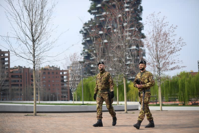 Italian army soldiers patrol streets after being deployed to the region of Lombardy to enforce the lockdown against the spread of coronavirus disease (COVID-19) in Milan