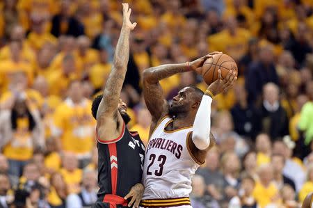 May 17, 2016; Cleveland, OH, USA; Cleveland Cavaliers forward LeBron James (23) drives against Toronto Raptors forward James Johnson (3) during the third quarter in game one of the Eastern conference finals of the NBA Playoffs at Quicken Loans Arena. The Cavs won 115-84. Mandatory Credit: Ken Blaze-USA TODAY Sports