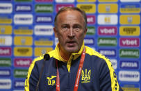 Ukraine head coach Oleksandr Petrakov speaks, during a press conference, at Hampden Park, in Glasgow, Scotland, Tuesday May 31, 2022. Scotland will play Ukraine in a World Cup qualifier soccer match on Wednesday. (Andrew Milligan/PA via AP)