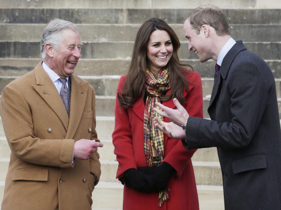 Prince Charles laughs with Kate Middleton and Prince William.