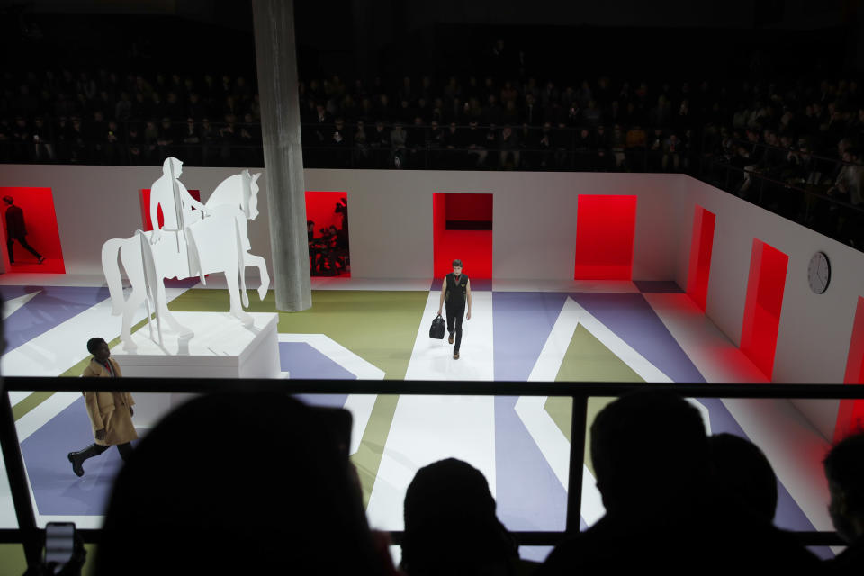 A model wears a creation as part of the Prada men's Fall-Winter 2020/21 collection, that was presented in Milan, Italy, Sunday, Jan. 12, 2020. (AP Photo/Antonio Calanni)