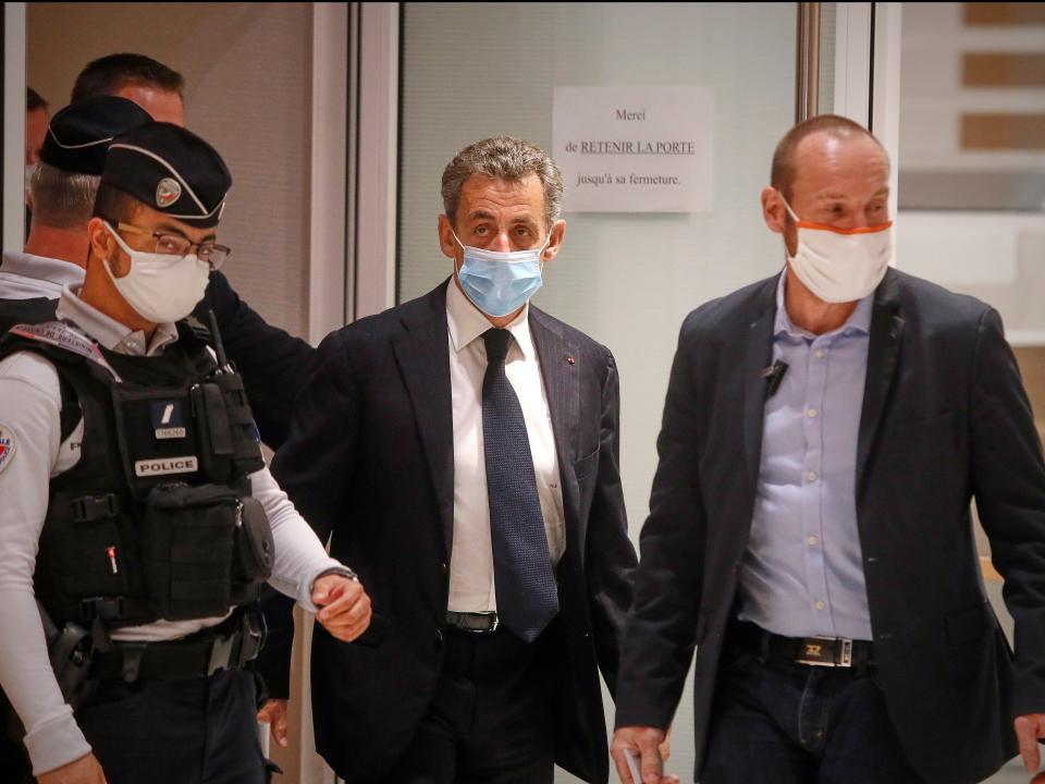 Former French President Nicolas Sarkozy leaves court after the opening of his trial for corruption and influence pedalling (Kiran Ridley/Getty Images)