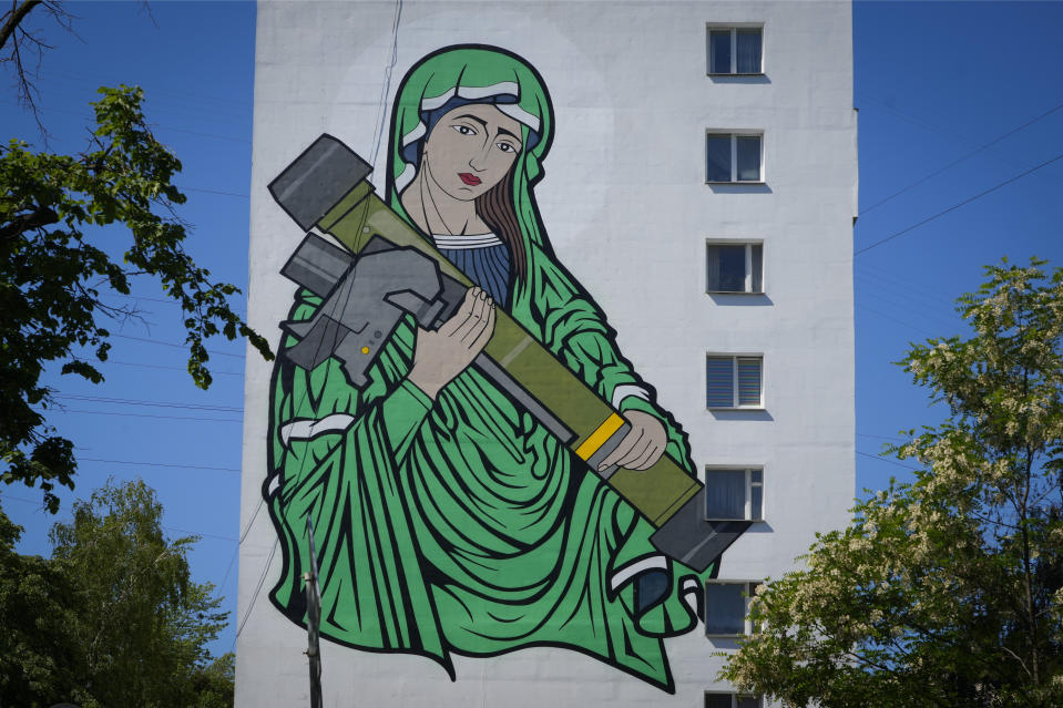 A mural depicts an image known as "Saint Javelina"- Virgin Mary cradling a US-made FGM-148 anti-tank weapon Javelin - on a living house wall in Kyiv, Ukraine, Monday, June 6, 2022. These missiles are among the arms being sent by Western allies to Ukrainian forces to aid in their fight against the Russian invaders. Javelin is widely considered a symbol of Ukraine's defence.(AP Photo/Efrem Lukatsky)