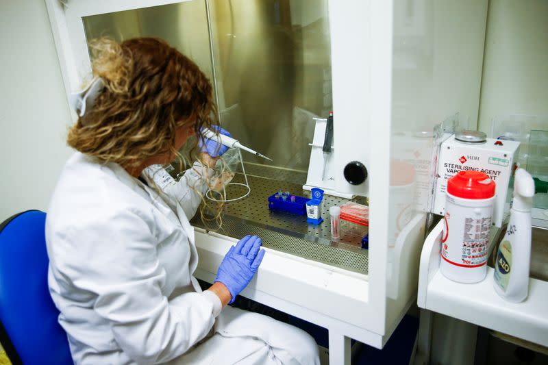 A medical worker tests swabs for the novel coronavirus at the Microbiology department of North Devon District Hospital in Barnstaple