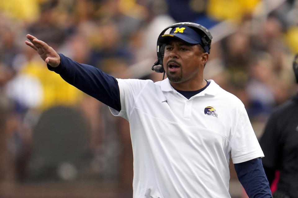 Michigan run game coordinator Mike Hart watches against UNLV in the second half of an NCAA college football game in Ann Arbor, Mich., Saturday, Sept. 9, 2023. (AP Photo/Paul Sancya)