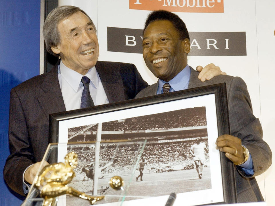 Former International soccer players England goal keeper, Gordon Banks (left) with a picture of his famous save from Brazil striker Pele (right).