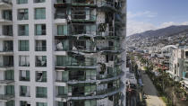 Damaged buildings stand after Hurricane Otis ripped through Acapulco, Mexico, Thursday, Oct. 26, 2023. The hurricane that strengthened swiftly before slamming into the coast early Wednesday as a Category 5 storm has killed at least 27 people as it devastated Mexico's resort city of Acapulco. (AP Photo/Felix Marquez)