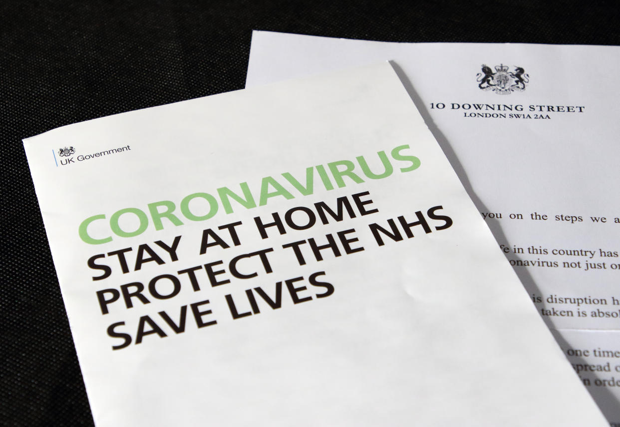  In this photo illustration, a letter from the British Prime Minster and HM Government Coronavirus leaflet are seen on display. A coronavirus letter from the British Prime Minister Boris Johnson to be sent to every UK household urging the public to stay home. Around 30 million UK households will receive the Covid-19 letter, along with a leaflet about Coronavirus symptoms, guidelines and awareness. (Photo by Keith Mayhew / SOPA Images/Sipa USA) 