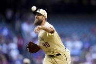 Arizona Diamondbacks starting pitcher Madison Bumgarner throws against the Los Angeles Dodgers during the first inning of a baseball game Friday, May 27, 2022, in Phoenix. (AP Photo/Ross D. Franklin)