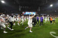 TCU players celebrate after the Fiesta Bowl NCAA college football semifinal playoff game against Michigan, Saturday, Dec. 31, 2022, in Glendale, Ariz. TCU defeated Michigan 51-45. (AP Photo/Ross D. Franklin)