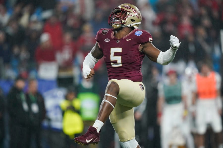 Florida State defensive lineman Jared Verse reacts after a play during the second half of the team’s Atlantic Coast Conference championship NCAA college football game against Louisville, Saturday, Dec. 2, 2023, in Charlotte, N.C. (AP Photo/Erik Verduzco)