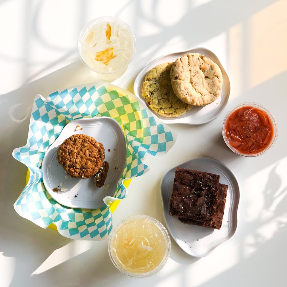 A few of Mina’s World’s offerings: Yuzu honey iced tea, pistachio rose cookie, rose iced chai, brownies, green grape lemonade, and an oatmeal cream pie.