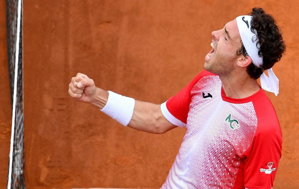 Marco Cecchinato of Italy celebrates after winning his men's singles first round match against Alex de Minaur of Australia, at the Italian Open tennis tournament in Rome, Italy, Monday, May 13, 2019. (Ettore Ferrari/ANSA via AP)