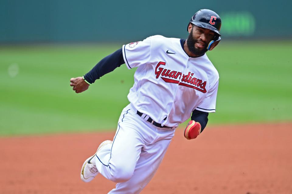 Cleveland Guardians' Amed Rosario rounds third on the way to scoring on an RBI-single by Owen Miller in the first inning of a baseball game against the Detroit Tigers, Sunday, May 22, 2022, in Cleveland. (AP Photo/David Dermer)