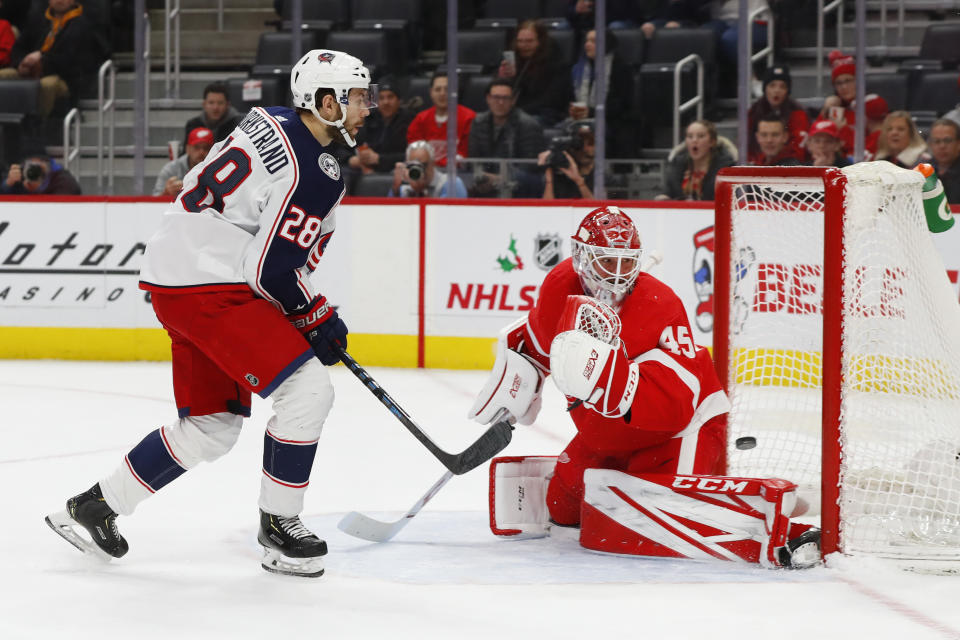 Columbus Blue Jackets right wing Oliver Bjorkstrand (28) scores on Detroit Red Wings goaltender Jonathan Bernier (45) in the first period of an NHL hockey game Tuesday, Dec. 17, 2019, in Detroit. (AP Photo/Paul Sancya)